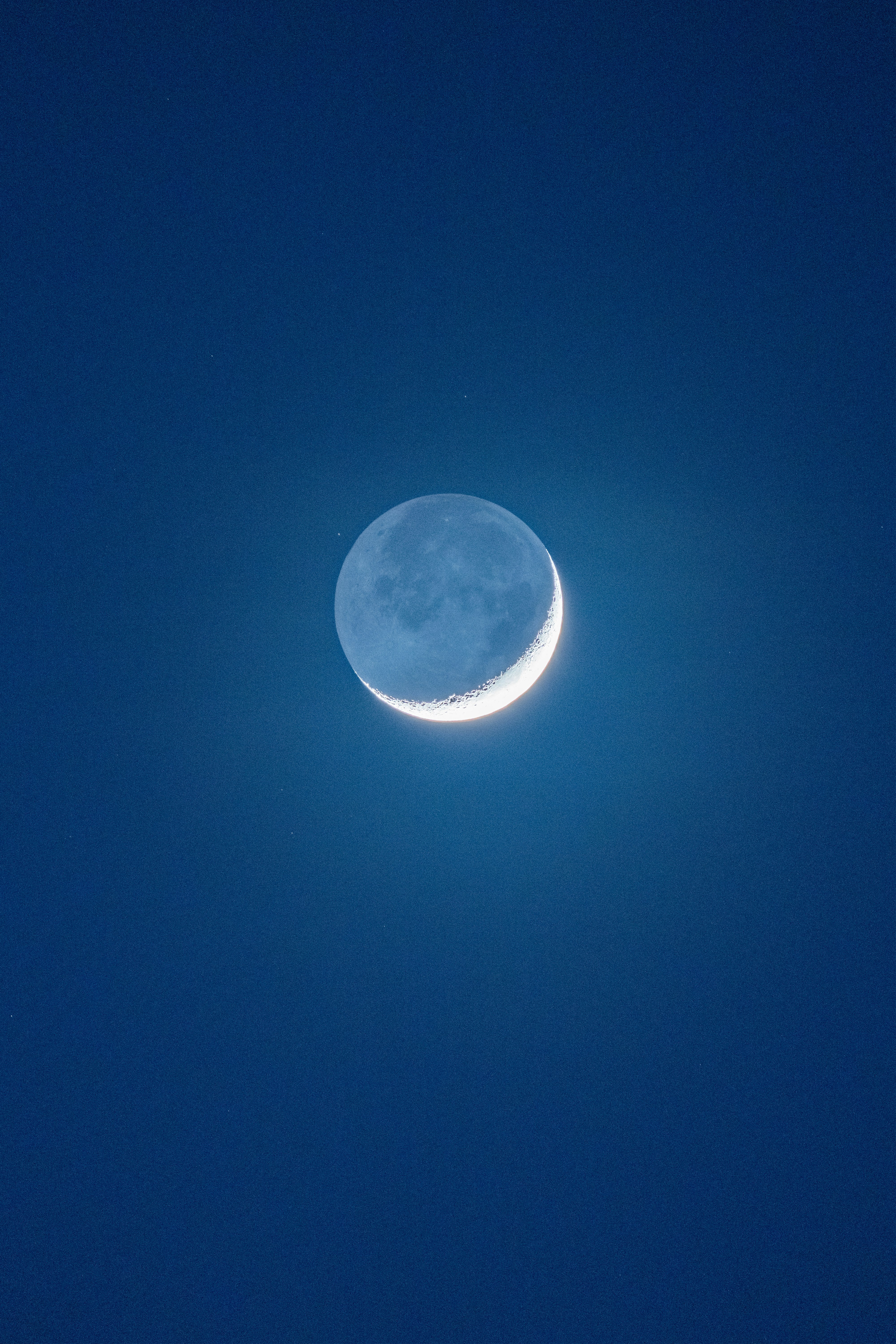 full moon on blue sky